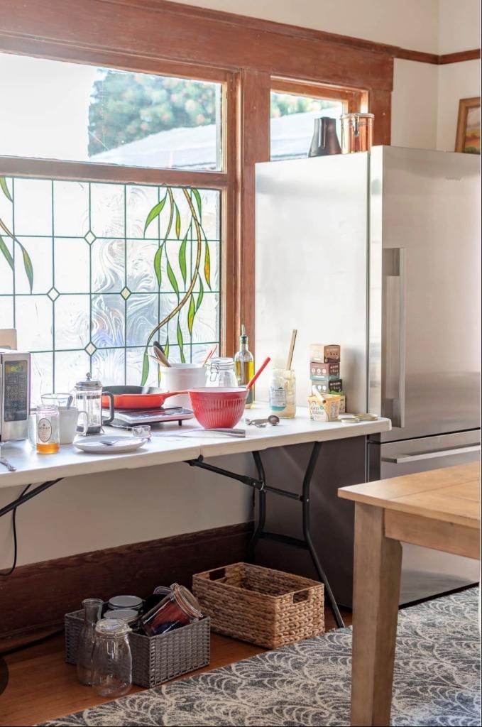 Temporary cooking setup on a folding table with appliances