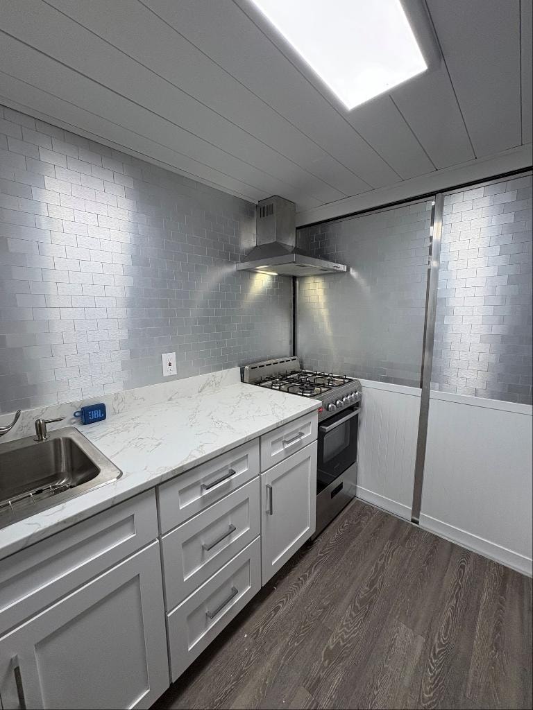 Counter seating area with stools and refrigerator