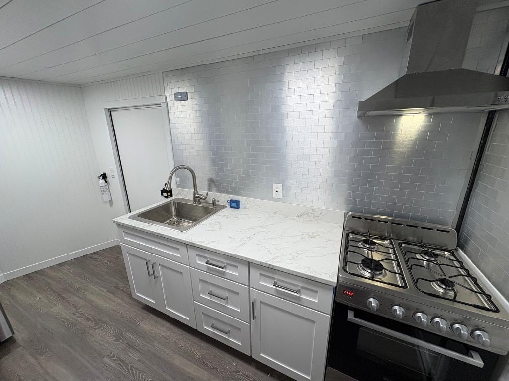 Wide-angle interior showing full kitchen layout